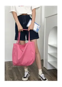 Pink canvas tote bag with large capacity, ideal for daily casual use and shoulder carry.
