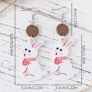 Vue détaillée des boucles d'oreilles lapin de Pâques en cuir PU et bois avec dimensions précises.