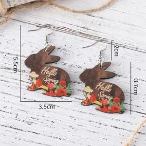 Easter wooden rabbit earrings detail shot with spring flower print and measurement dimensions.