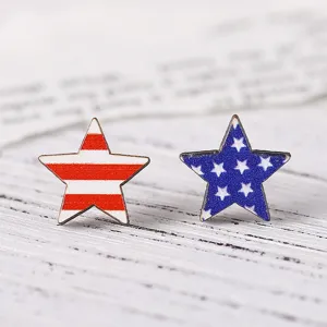 Detailed close-up of American flag wooden star stud earrings, vintage red white and blue design.