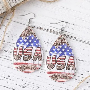Detailed shot of American flag leopard print teardrop PU leather earrings with USA text.