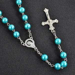 Blue faux pearl rosary necklace with cross pendant for fashion unisex daily wear styling.