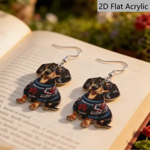 Vue détaillée de jolies boucles d'oreilles pendantes teckel en acrylique 2D de Noël.