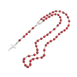 Classic red bead rosary necklace featuring a detailed silver metal crucifix and centerpiece.