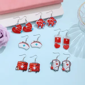Cute nurse theme acrylic dangle earrings set with stethoscope heart and medical bag designs.