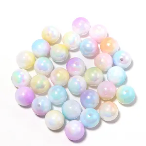 Close-up detail shot of colorful iridescent acrylic beads for DIY handmade jewelry crafts.