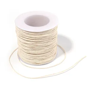 Beige waxed cord spool detail view for DIY handmade bracelet weaving and beading.