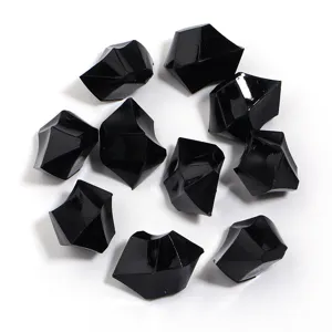 Detail view of black irregular acrylic ice stones, perfect for DIY jewelry and crafts.