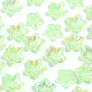 Detailed view of translucent green AB color five petal star acrylic beads for DIY jewelry making.