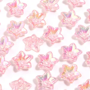 Close-up view of shiny pink iridescent acrylic star flower loose beads showing texture.