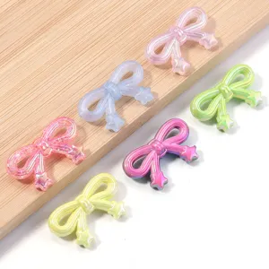 Colorful acrylic star bow charms close-up, perfect DIY jewelry making accessories for bracelets and crafts.
