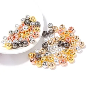 Close-up detail of mixed metallic CCB round spacer beads for DIY jewelry crafting.