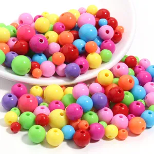 Detail view of colorful acrylic macaron round beads for DIY jewelry making and bracelet crafting