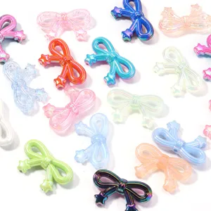 Detailed view of vibrant acrylic bow beads with star pendants, ideal for handmade DIY items.