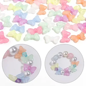 Colorful translucent acrylic bow beads detail for DIY jewelry making and handmade bracelet charms.