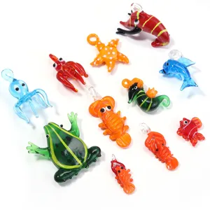 Close-up of colorful glass animal pendants, handmade octopus frog dolphin charms.