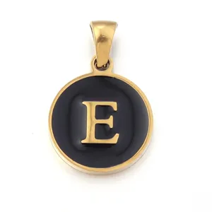 Close-up view of golden stainless steel letter E pendant with black enamel fill details.