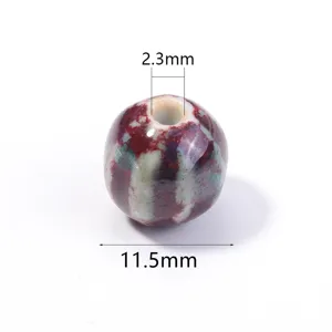 Glazed ceramic striped pumpkin bead DIY jewelry accessory for bracelets and necklaces.