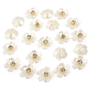 Resin pearl flower charms close-up detail view, sparkling rhinestone flatback cabochon.