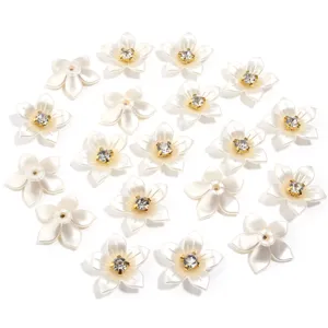 Close-up detail of white resin rhinestone imitation pearl flower DIY accessories for crafts.