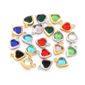 Close-up detail of colorful heart crystal charms with metal bezel for diy jewelry making.