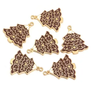 Close up detail of brown enamel Christmas tree alloy pendant with rhinestones for DIY jewelry.