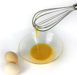 Detail view of the 8-inch stainless steel wire egg whisk in action, perfect for kitchen baking.