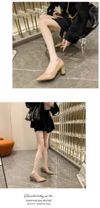 Detail view of women's nude pointed toe chunky high heels shoes in luxury display scene.