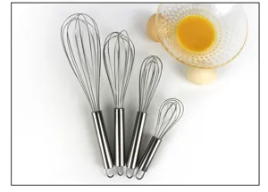 Detailed close-up view of stainless steel manual egg whisks, essential kitchen baking tool.