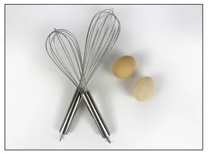 Stainless steel wire whisk detail view, kitchen baking tool for mixing eggs and batter easily.