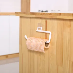 Wall-mounted adhesive paper towel holder for kitchen, white plastic towel and rag rack.