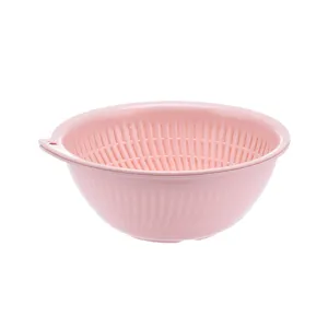 Pink double layer draining basket and fruit colander for kitchen vegetable washing tool.