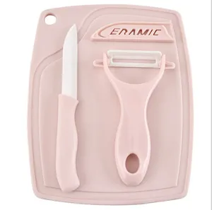 Pink ceramic knife set with cutting board, fruit knife and peeler for kitchen cooking.