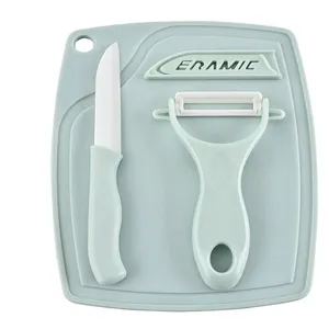 Detailed view of the 3-piece ceramic fruit knife, peeler, and cutting board set in mint green.