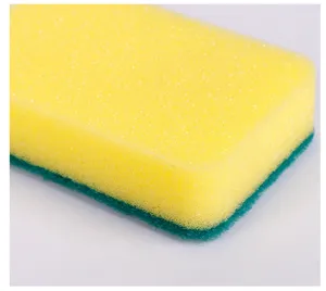 Detailed close-up of a dual-layer kitchen cleaning sponge with yellow foam and green scouring pad.