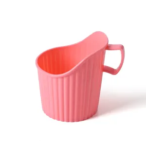 Pink plastic disposable cup holder with handle, ribbed anti-scald coffee sleeve base.