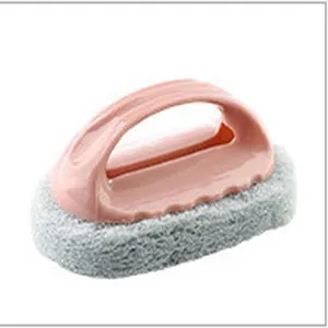 Detail view of the kitchen cleaning sponge brush with ergonomic pink handle and textured gray base.