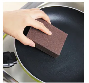 Brown corundum cleaning sponge for kitchen pot and pan rust removal, durable abrasive pad.