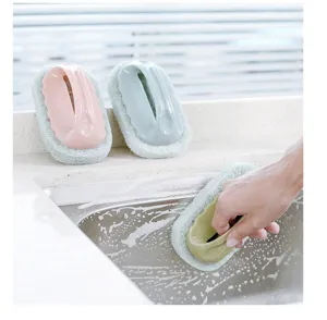 Detail view of cleaning sponge brush with handle for kitchen sink, bathtub, and tile cleaning.