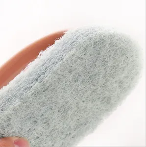 Kitchen heavy duty cleaning sponge pad macro view for pot and tile surface wiping tool.