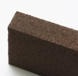 Emery abrasive sponge cleaning block for heavy duty kitchen pot rust removal and dish washing.