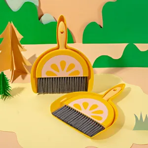 Cute cartoon fruit mini desktop broom and dustpan set for keyboard cleaning and desk cleanup.