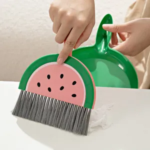 Mini watermelon desktop cleaning brush and dustpan set for keyboard and office desk use.