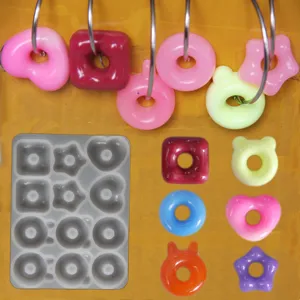 Silicone resin mold set featuring cute donut, bear, and star shapes for DIY jewelry and pendants.