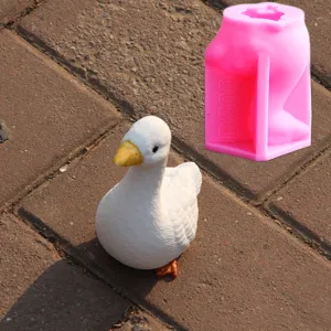 Silicone 3D white goose mold and finished duck figurine set for handmade DIY crafts.