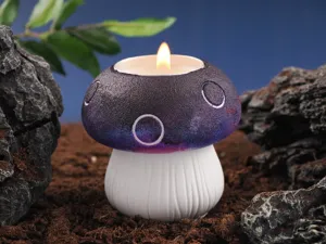 Closeup of the decorative mushroom candle detail featuring gradient purple cap and white stem.