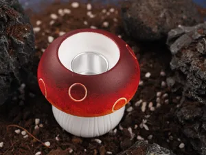 Detailed close-up shot of the handmade mushroom candle holder with unique red and white design.