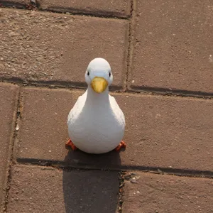 Detailed view of a cute white duck figurine, perfect for home decor and craft molding projects.