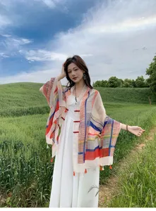 Detailed view of the colorful block patterned tassel shawl, perfect for summer sun protection.