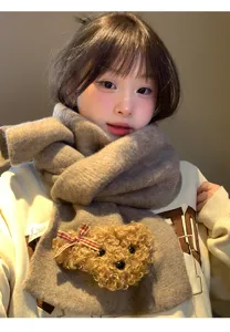 Cozy winter knitted scarf for women featuring a cute fluffy teddy bear and warm soft material.